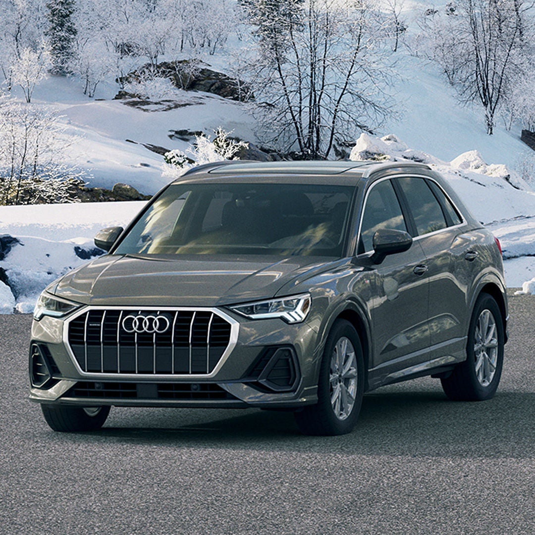 Right profile view of an Audi Q3 parked.